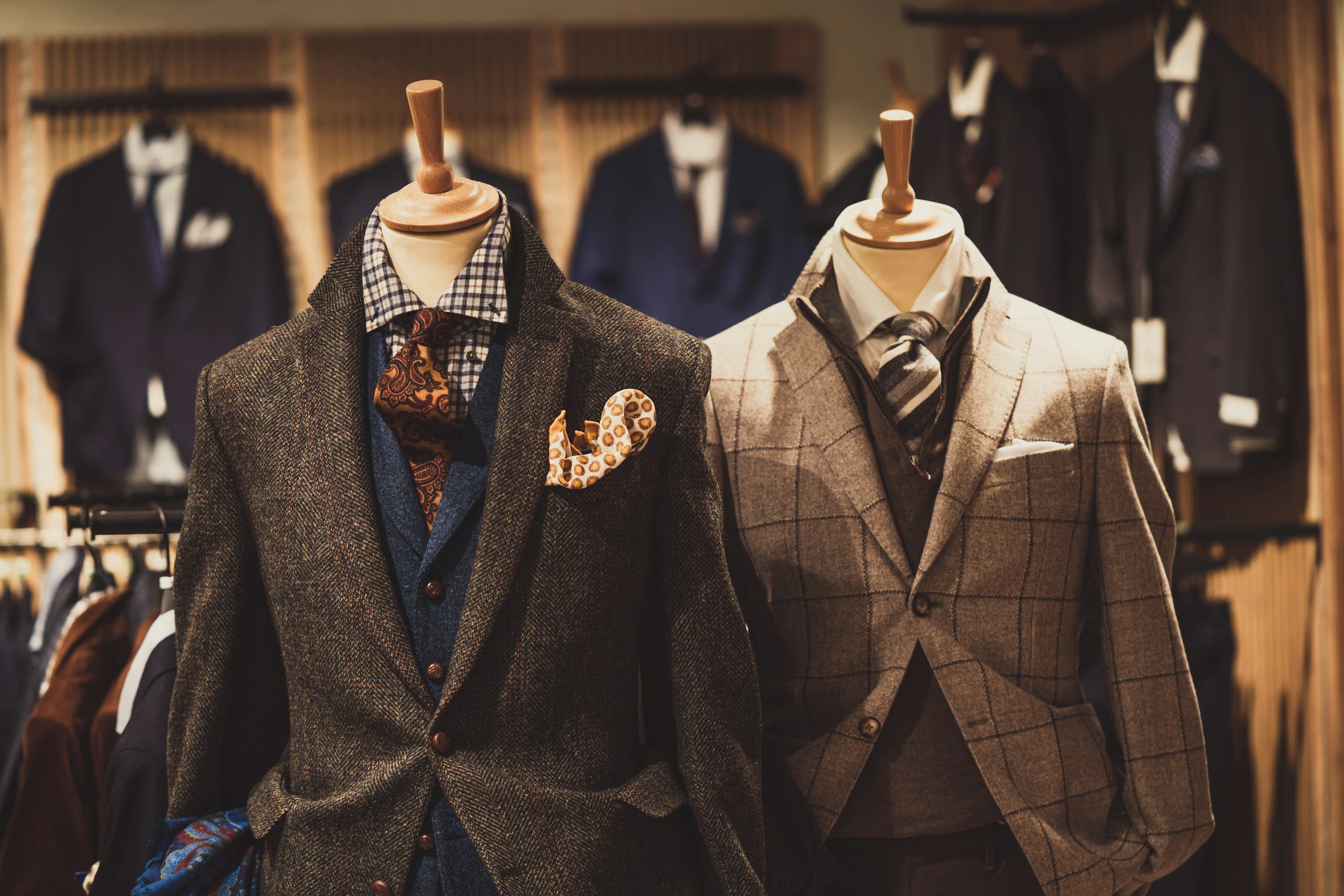 Hand-tailored jackets on display in a heritage atelier